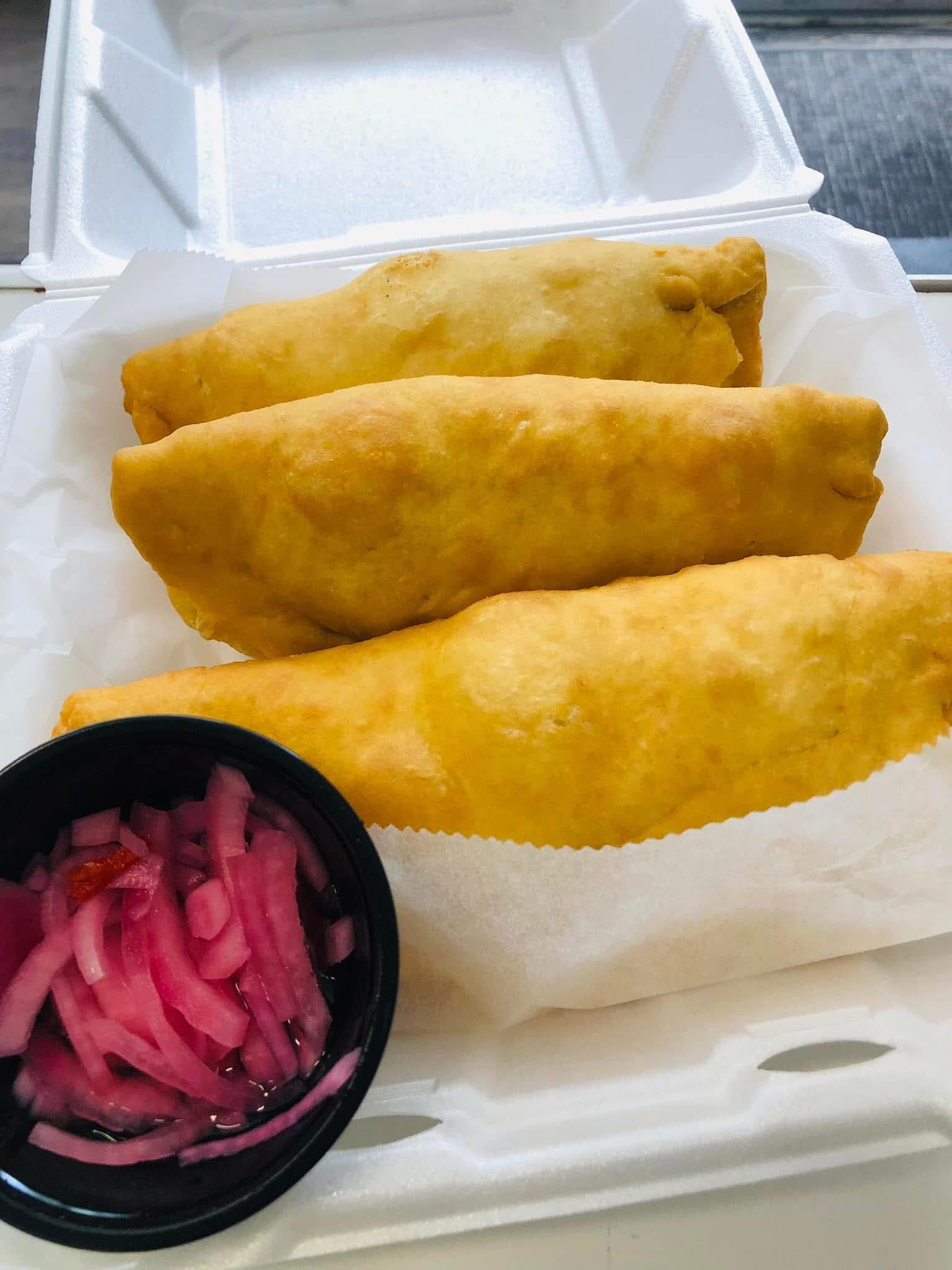 Belizean empanadas with pickled onion