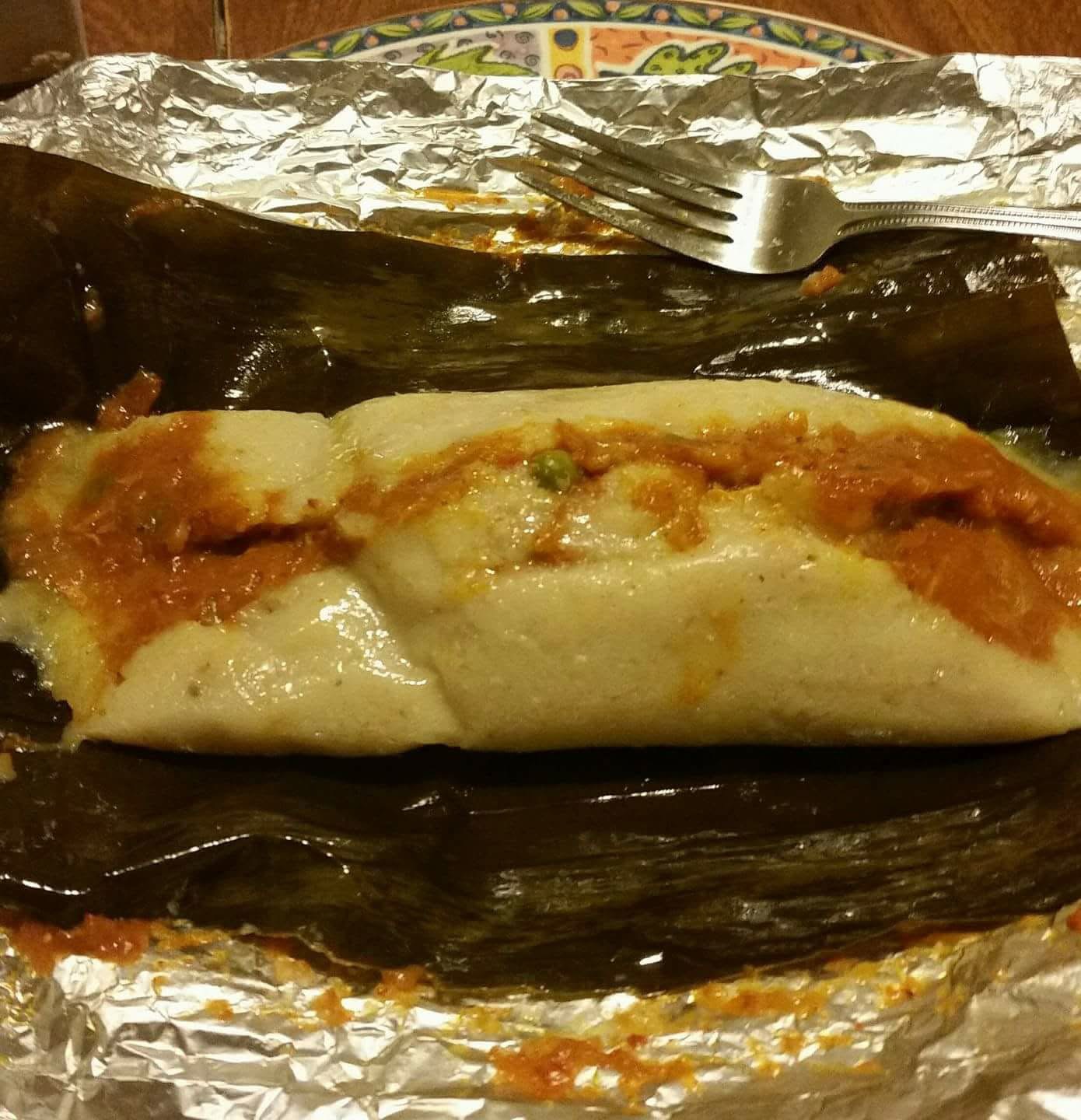 Belizean tamales wrapped in banana leaf